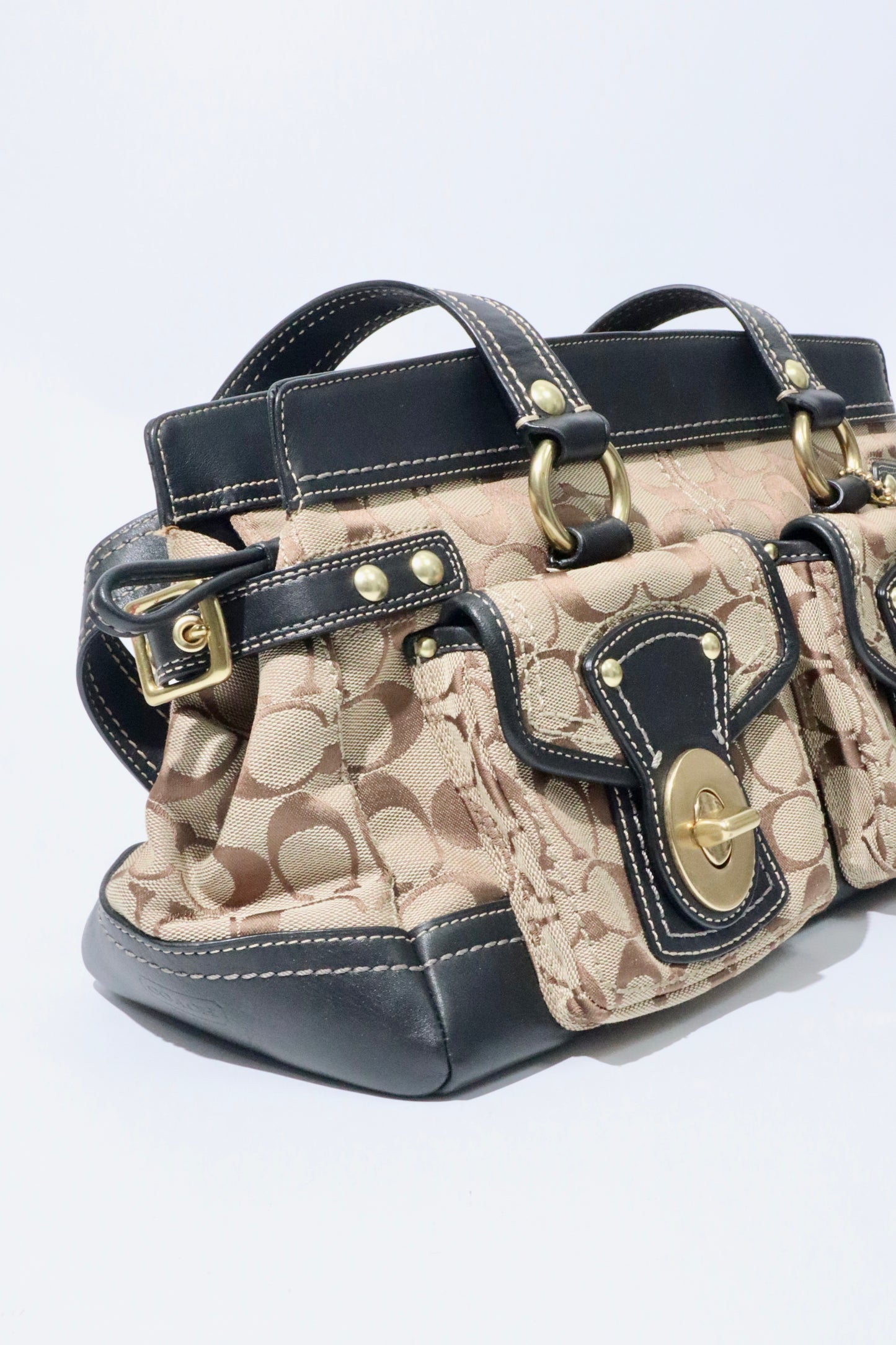 Coach Vintage 2002 Leather Satchel Gardenia Handbag in structured silhouette with classic bronze-tone hardware.
