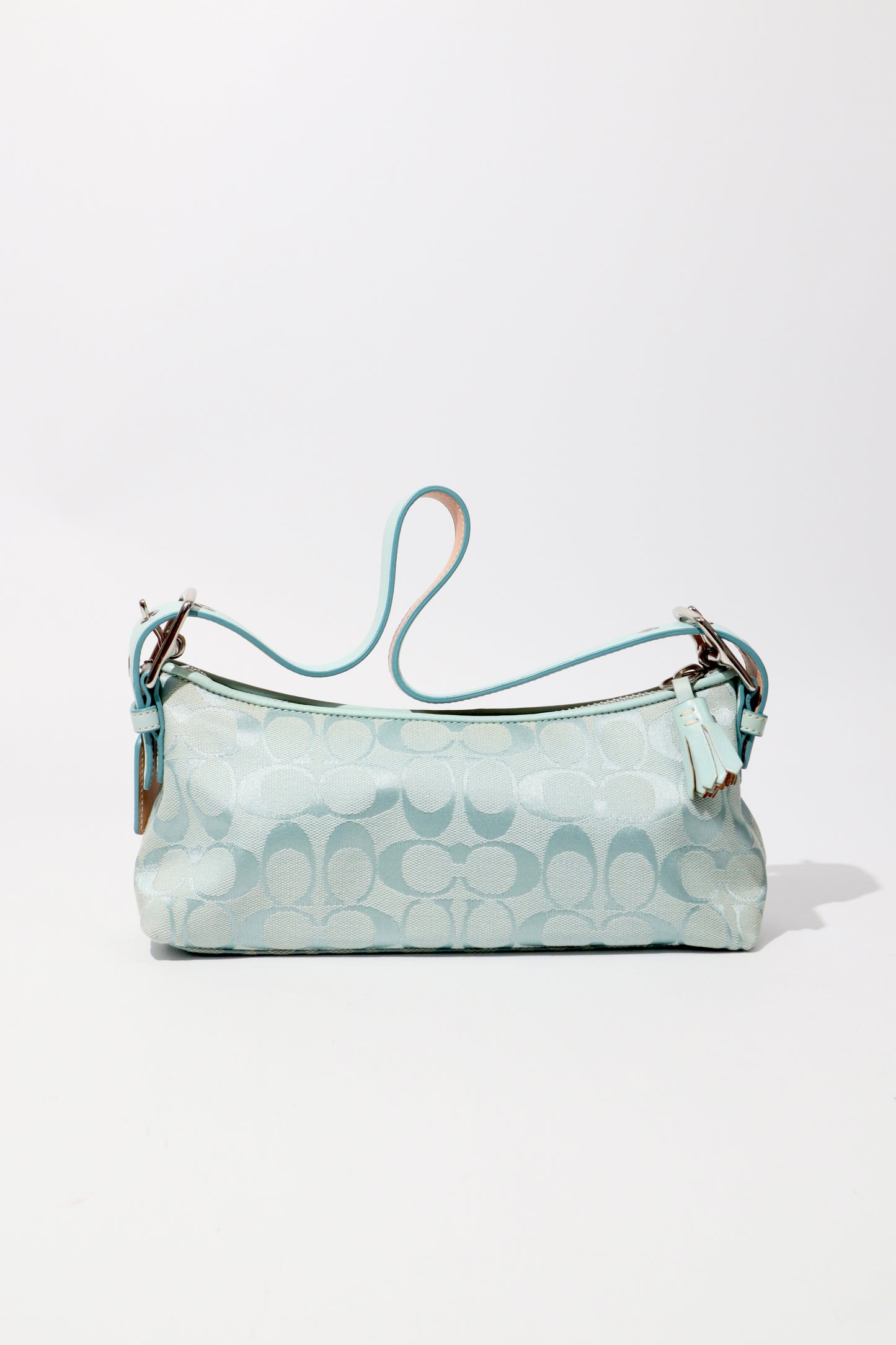 Coach Vintage 2004 Turquoise Demi Shoulder Bag standing upright showing the back
