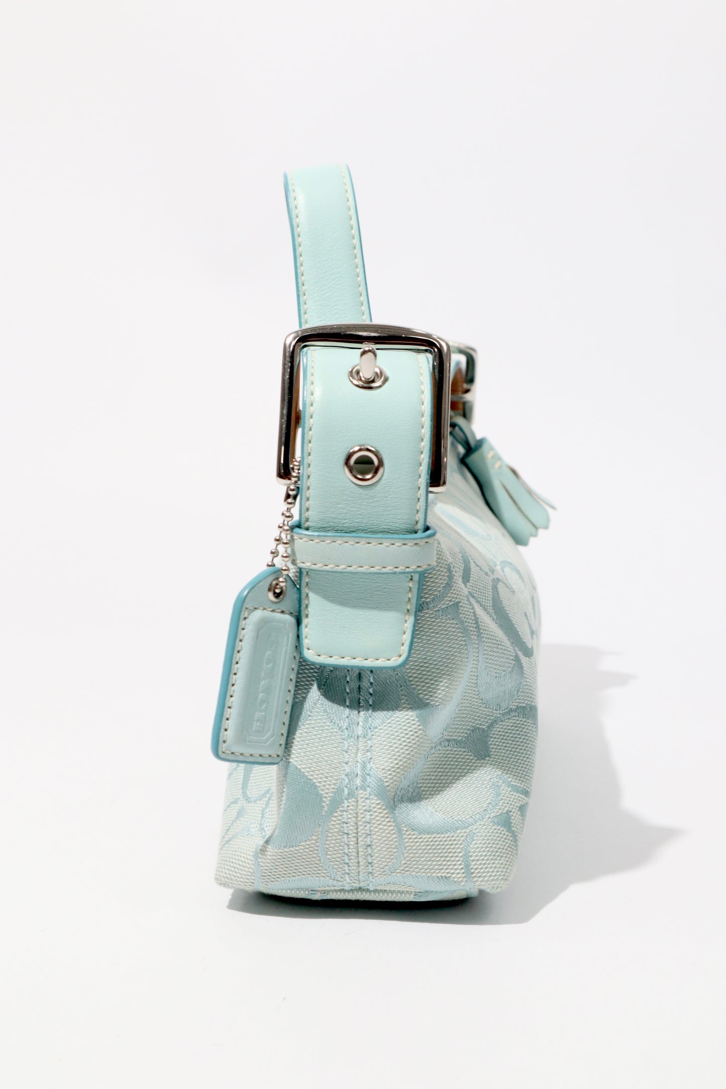 Coach Vintage 2004 Turquoise Demi Shoulder Bag standing upright showing structured shape