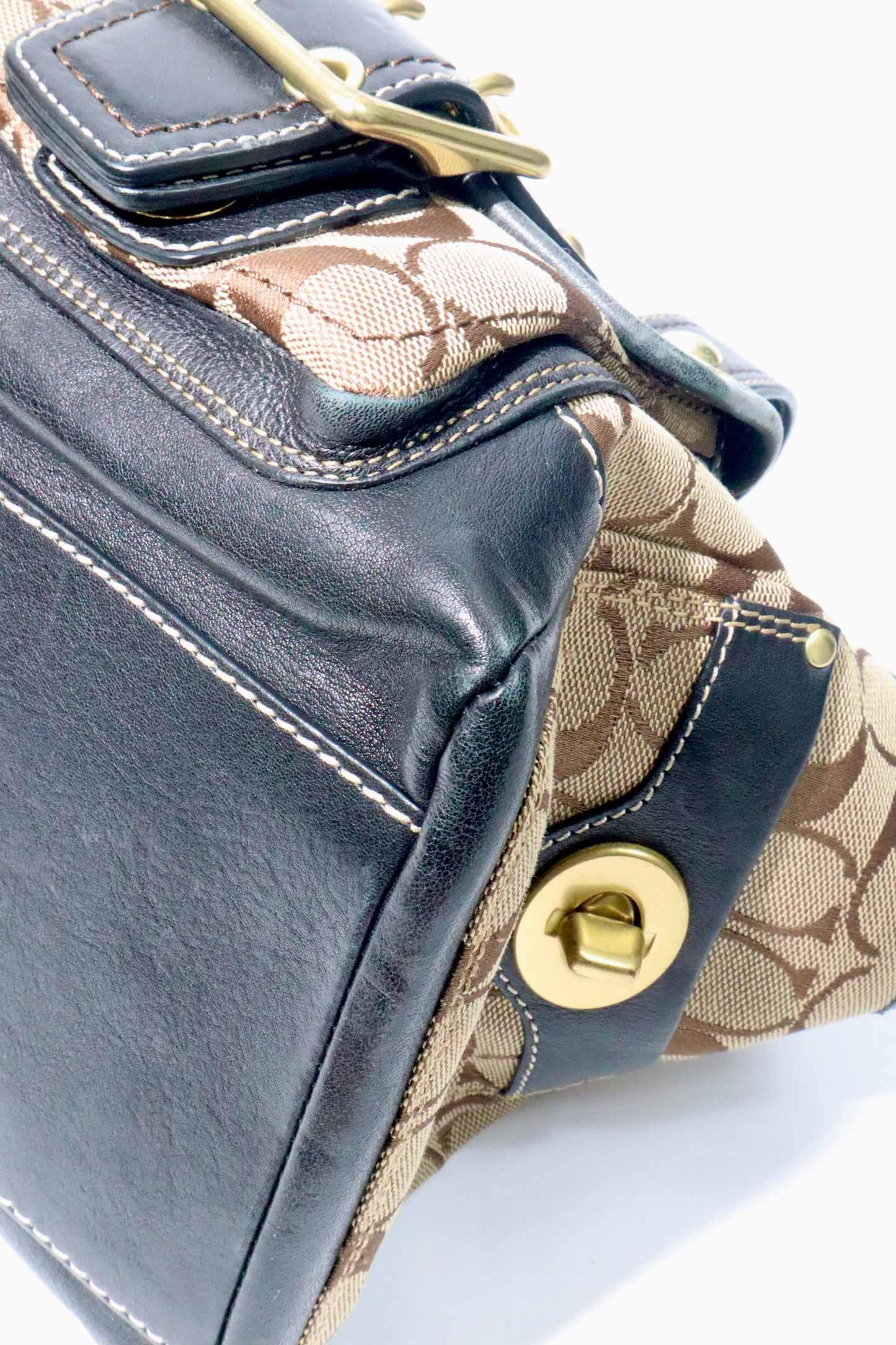 Coach Brown Signature 65th Anniversary Legacy Turnlock Rare Edition handbag with canvas and leather material.