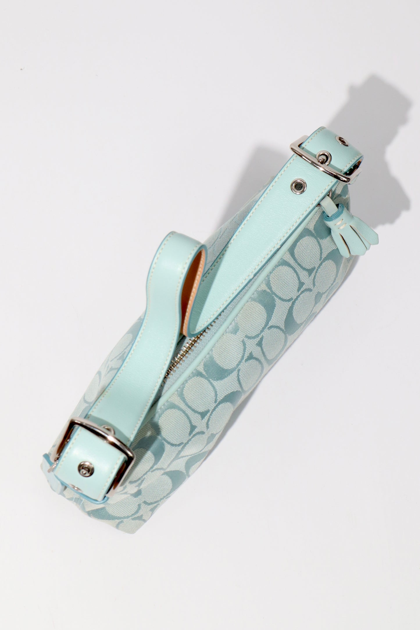 Coach Vintage 2004 Turquoise Demi Shoulder Bag close-up of leather strap and silver hardware