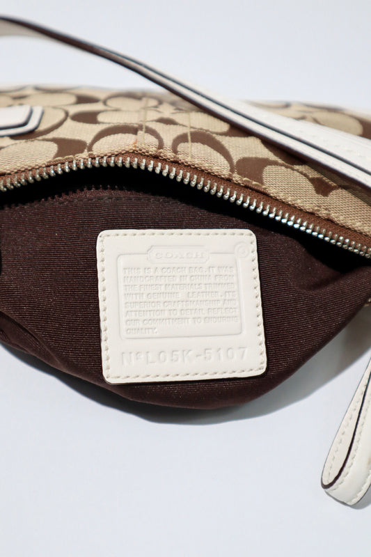 Vintage Coach 2005 Mini Belt Shoulder Bag in Tan & Brown interior view showing label and zipper detail.