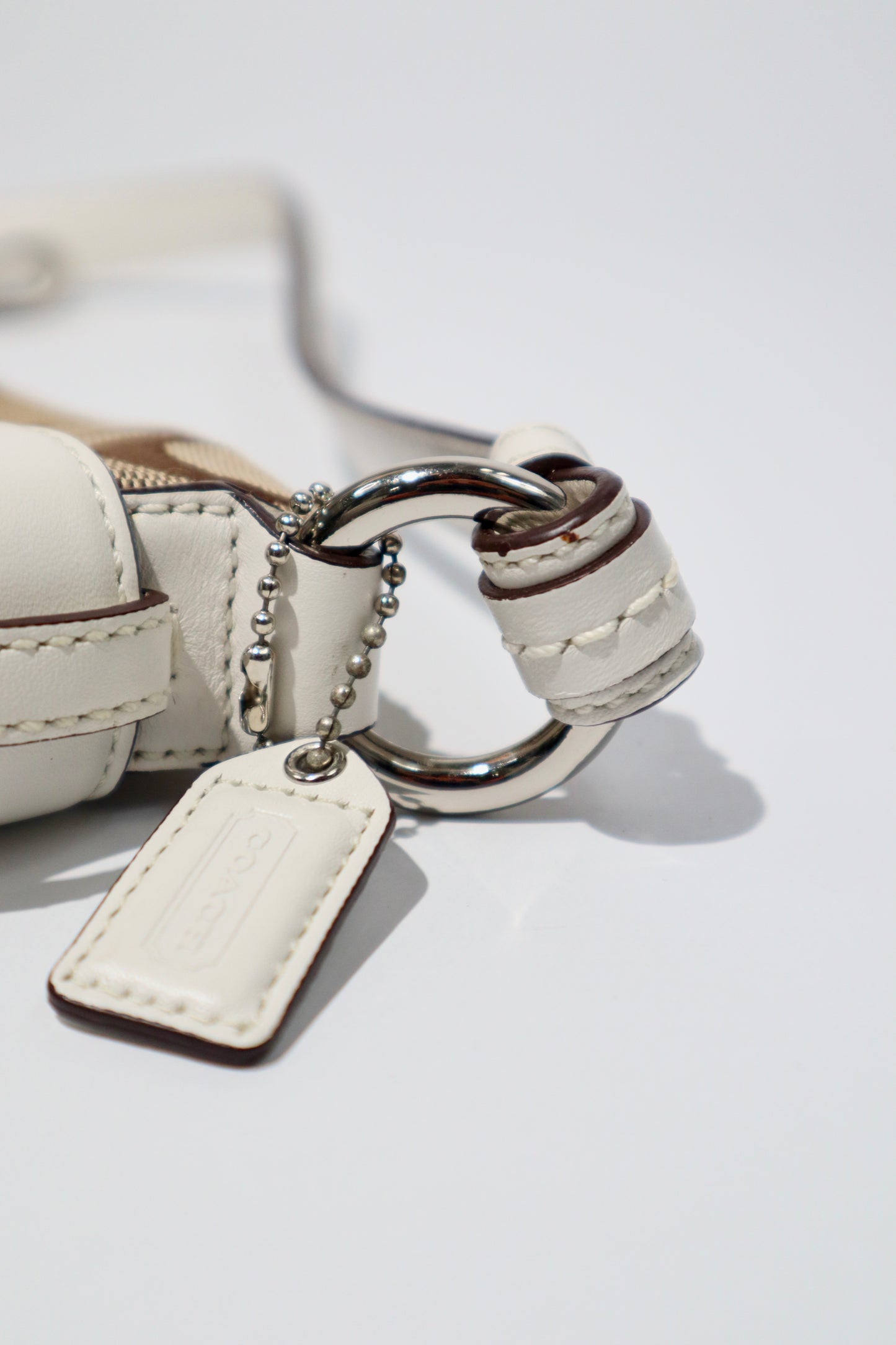 Vintage Coach 2005 Mini Belt Shoulder Bag in Tan & Brown close-up of hardware and tag detail