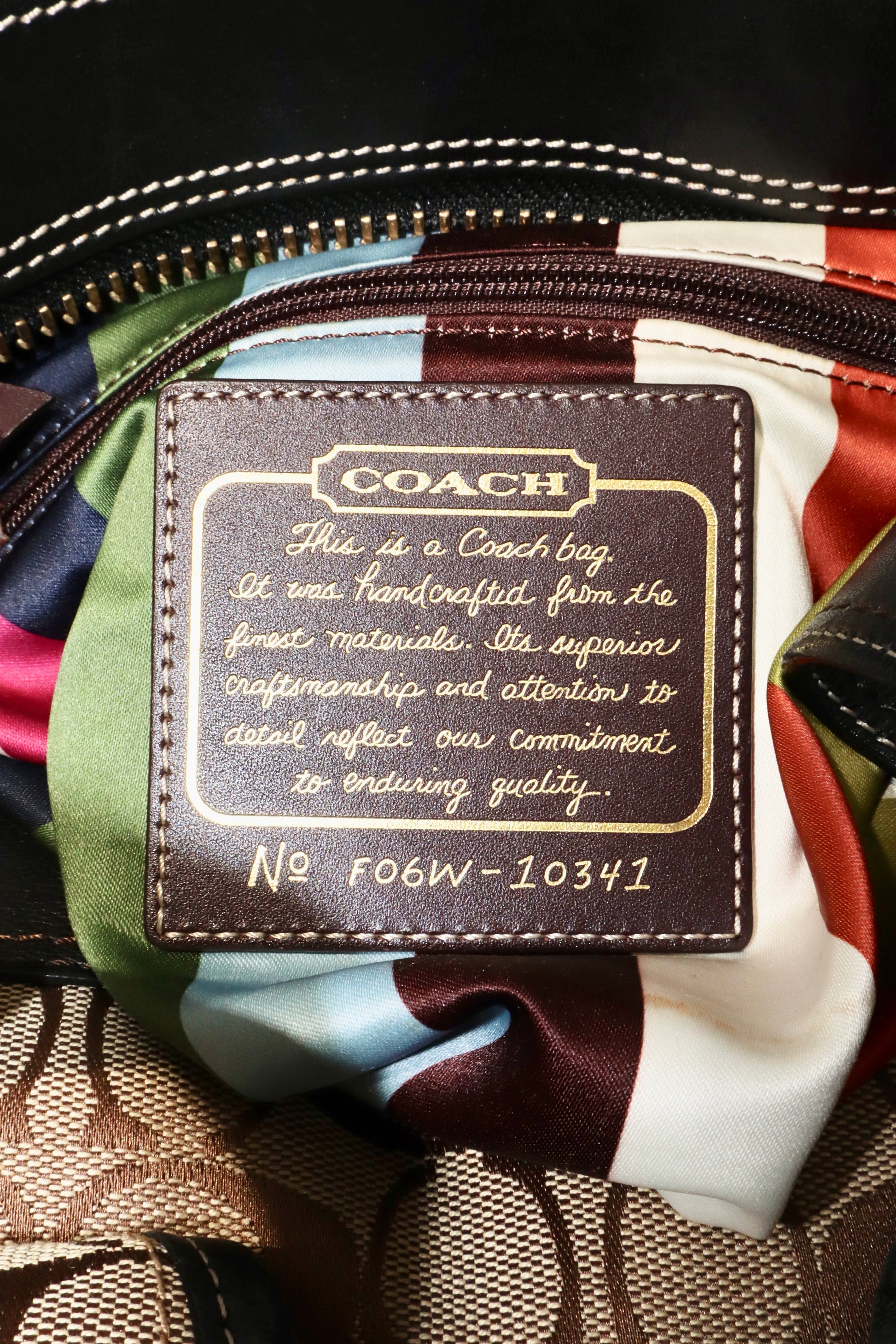 Coach Brown Signature 65th Anniversary Legacy Turnlock Rare Edition interior label showcasing craftsmanship quality