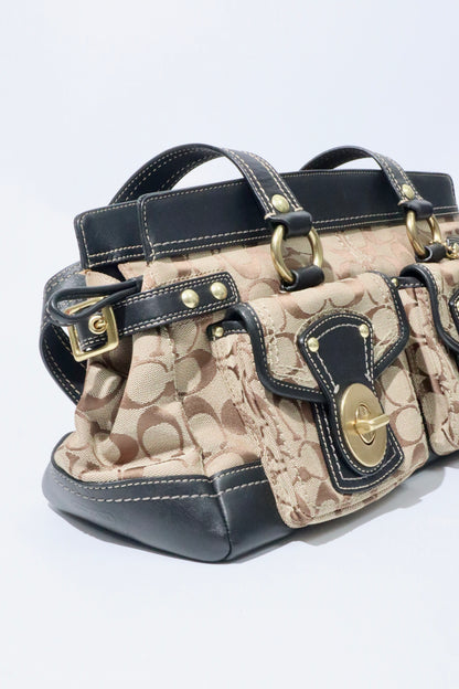 Coach Vintage 2002 Leather Satchel Gardenia Handbag in structured silhouette with classic bronze-tone hardware.