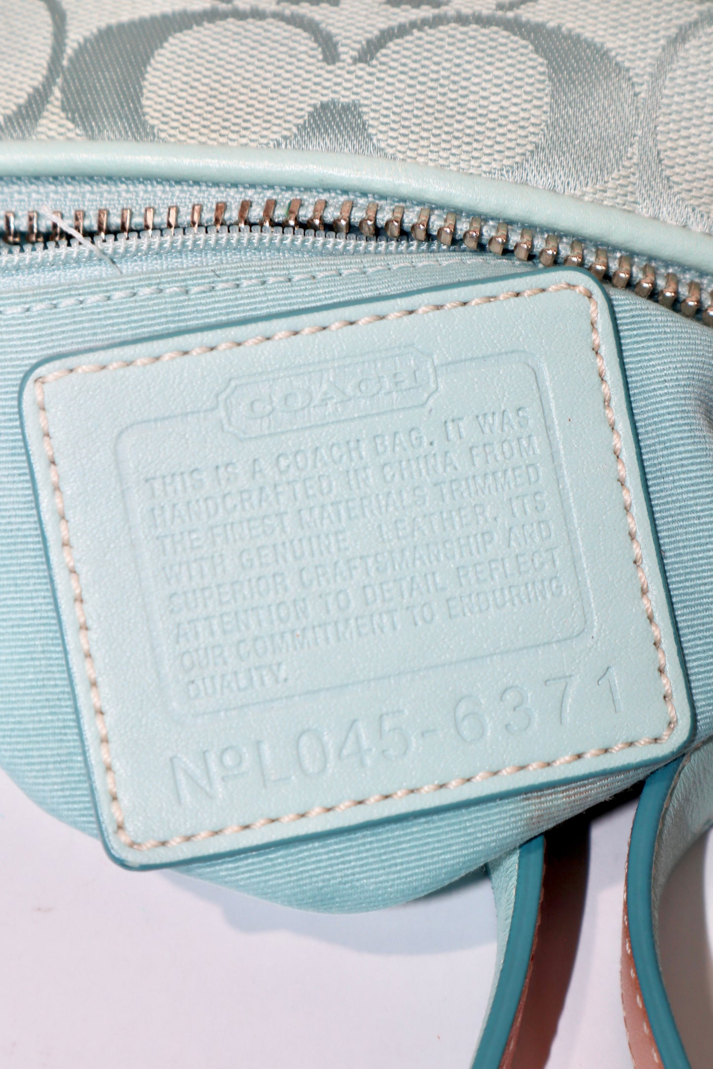 Coach Vintage 2004 Turquoise Demi Shoulder Bag interior with cotton lining and pocket