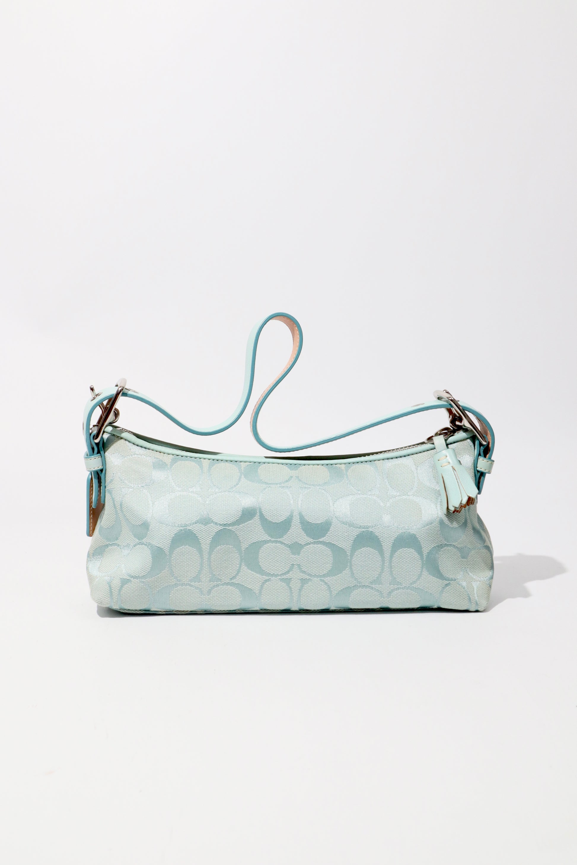 Coach Vintage 2004 Turquoise Demi Shoulder Bag standing upright showing the back