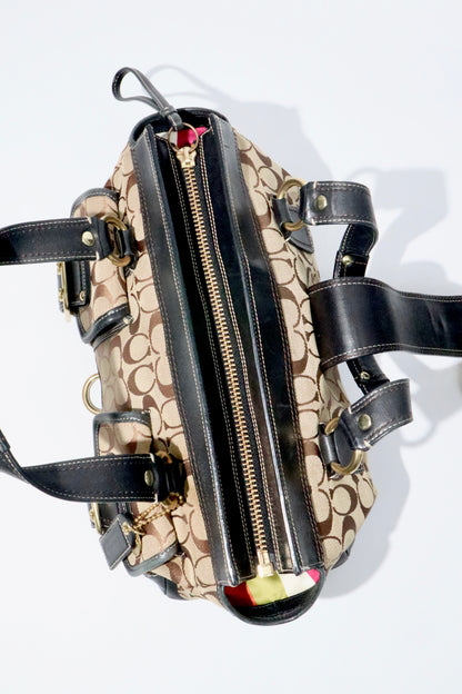 Coach Brown Signature 65th Anniversary Legacy Turnlock Rare Edition bag with canvas and leather materials.