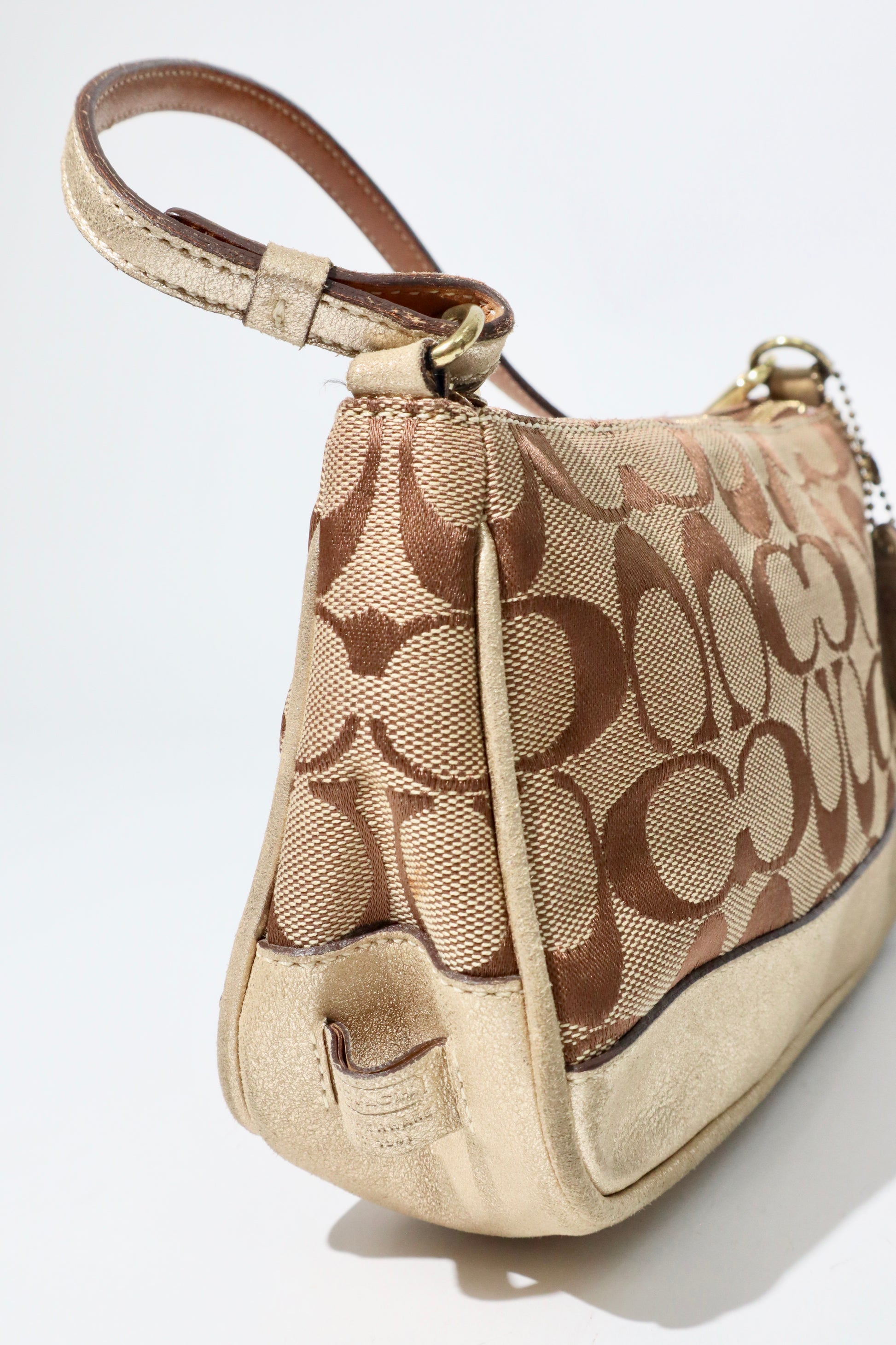 Coach Vintage 2005 Y2K Canvas Mini Pouch Brown & Gold angled view with gold leather trim