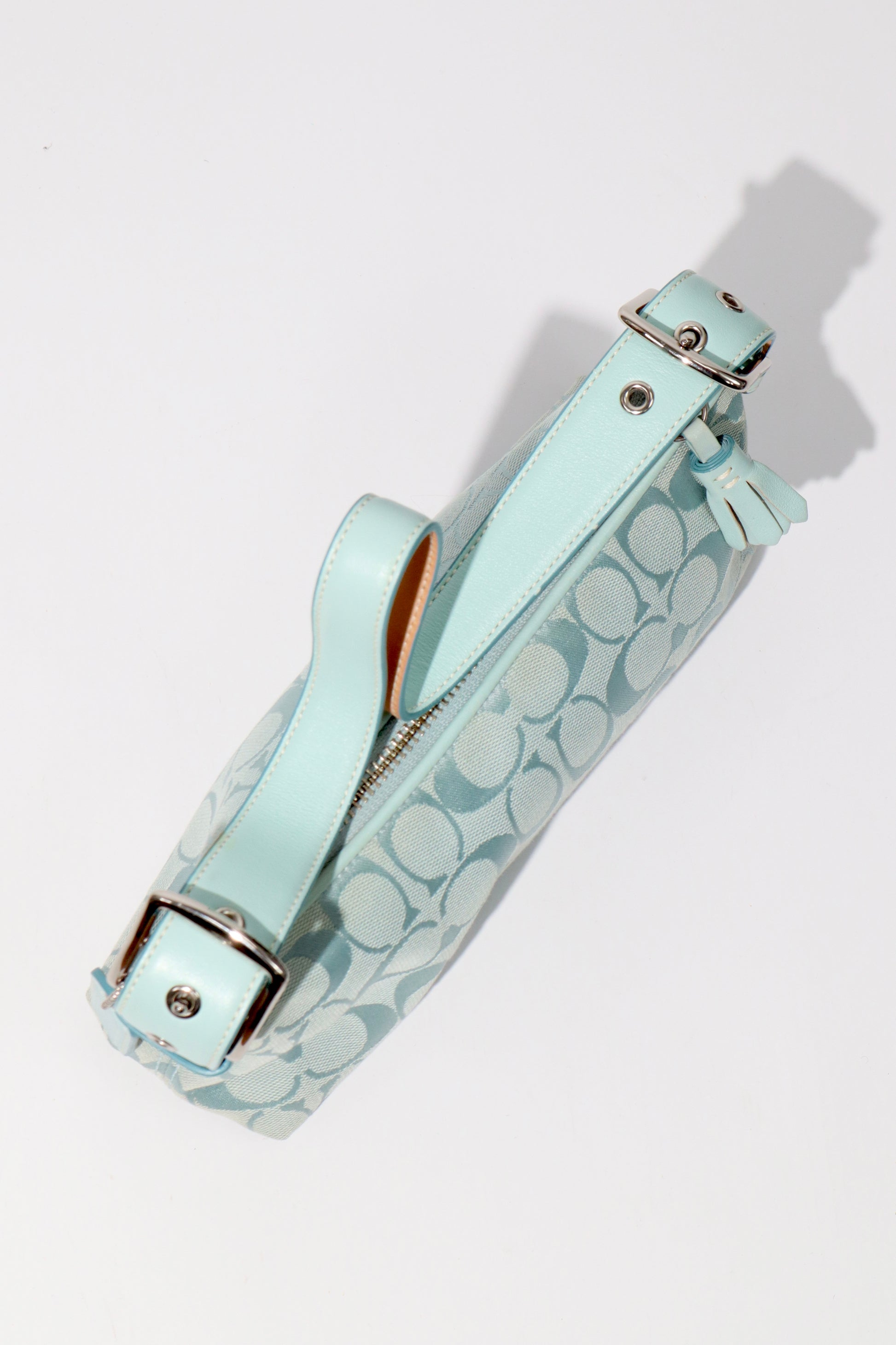 Coach Vintage 2004 Turquoise Demi Shoulder Bag close-up of leather strap and silver hardware