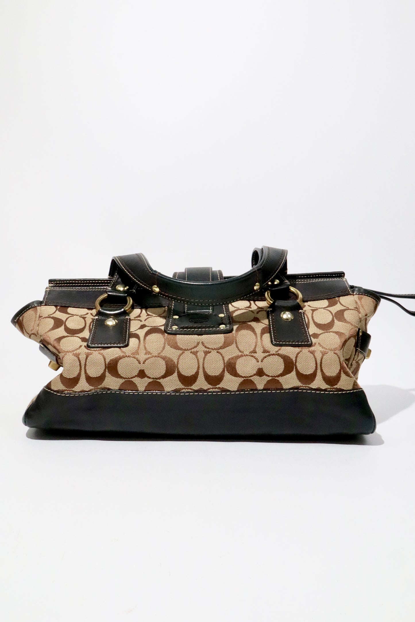 Coach Brown Signature 65th Anniversary Legacy Turnlock Rare Edition handbag in canvas and leather material