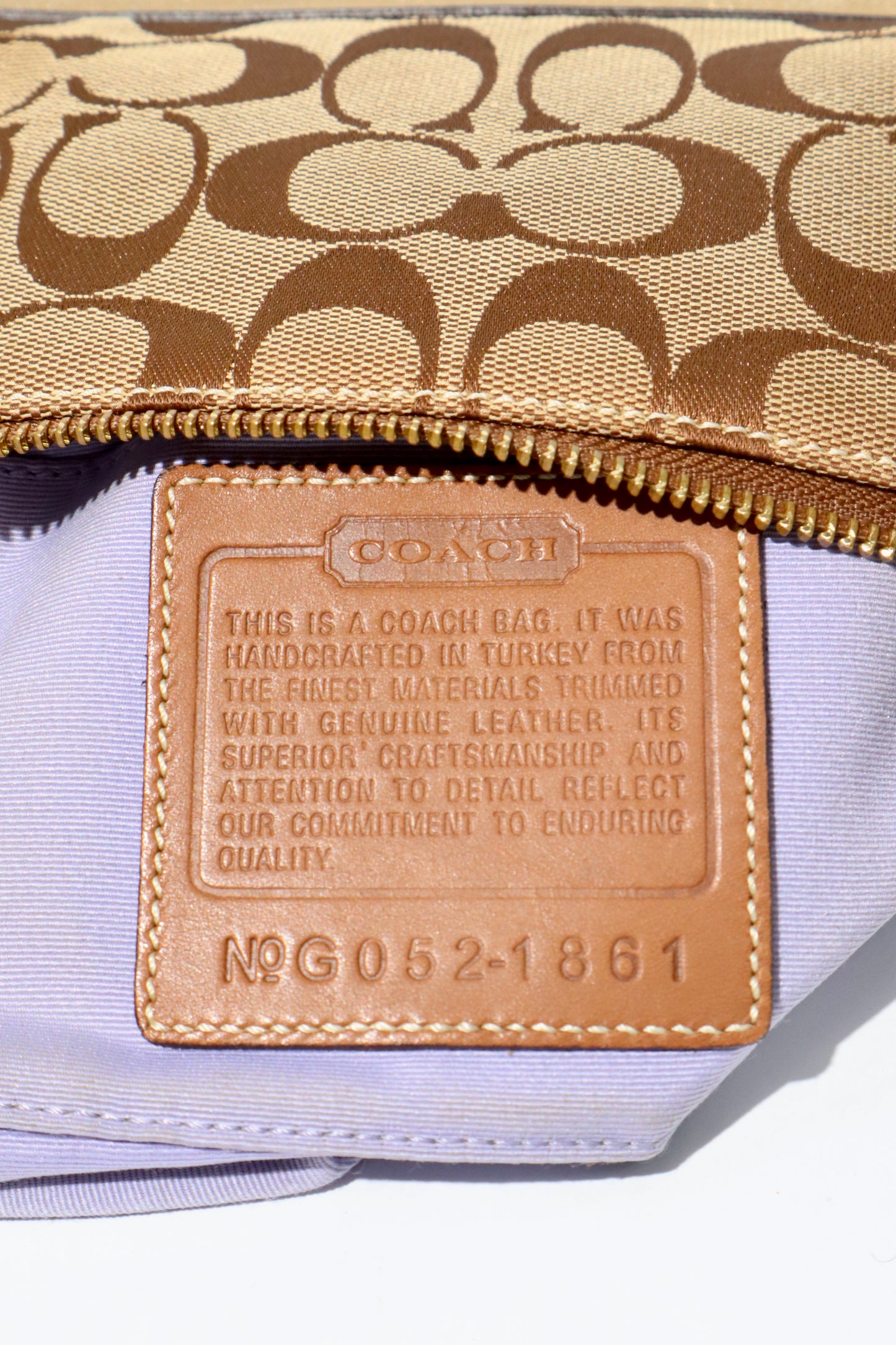 Coach Vintage 2005 Y2K Canvas Mini Pouch Brown & Gold close-up of leather logo patch