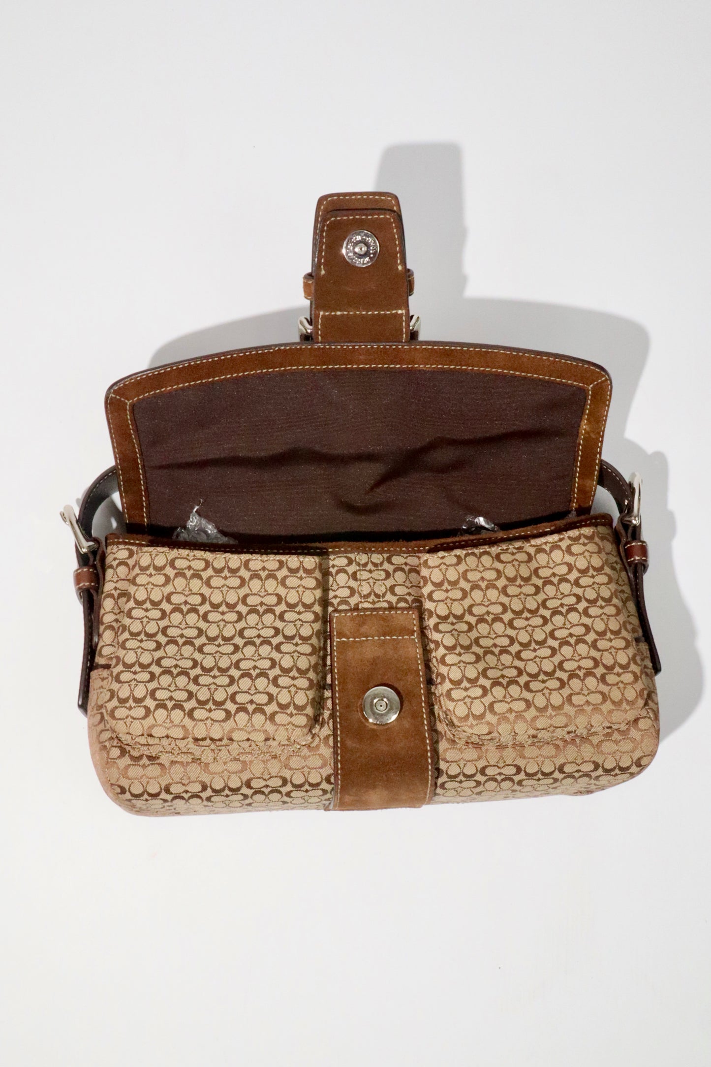 Coach 2005 Vintage Soho Buckle Shoulder Bag in Brown Suede open view showing cotton lining