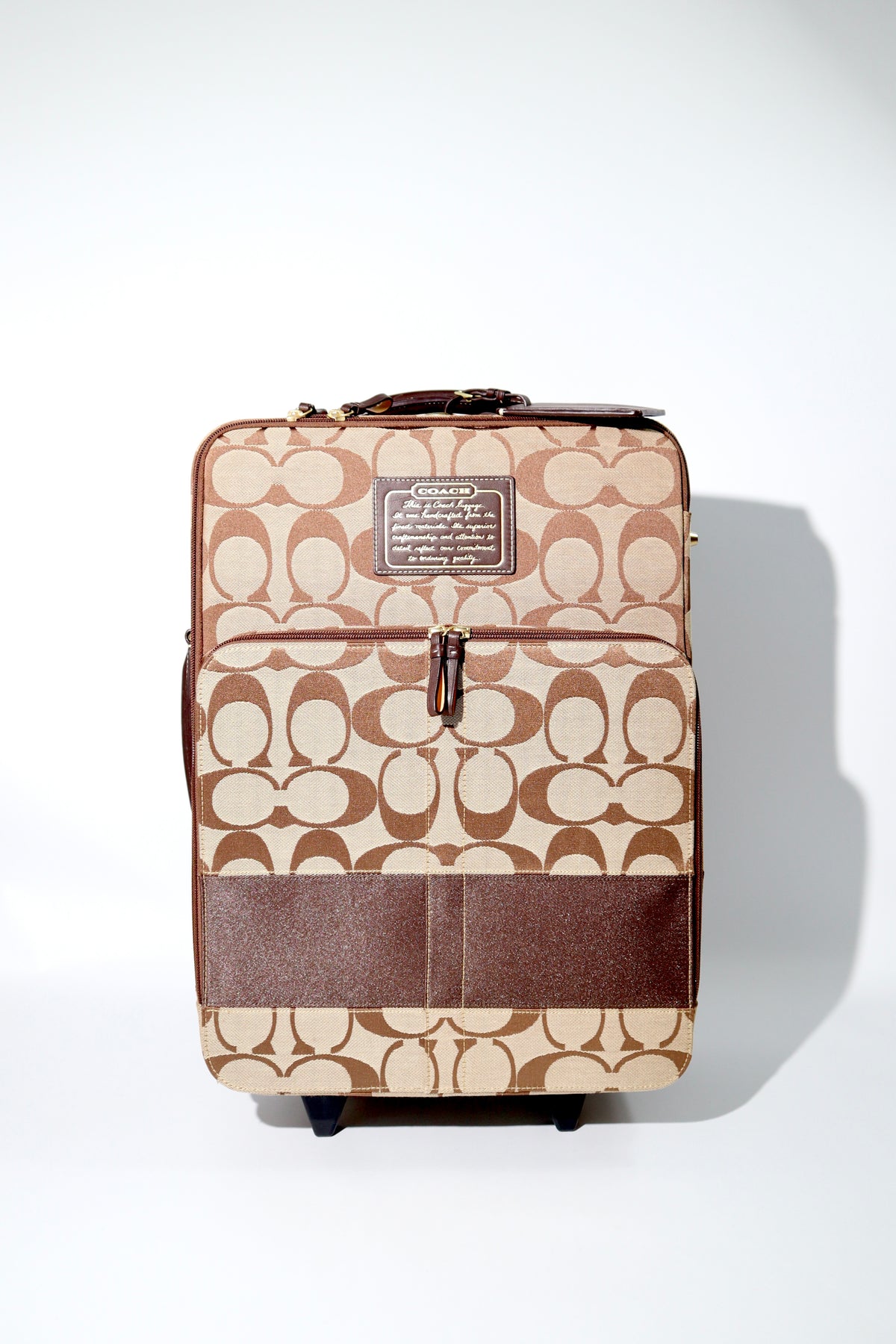 Coach Signature Canvas Rolling Carry-On Suitcase, model F77020