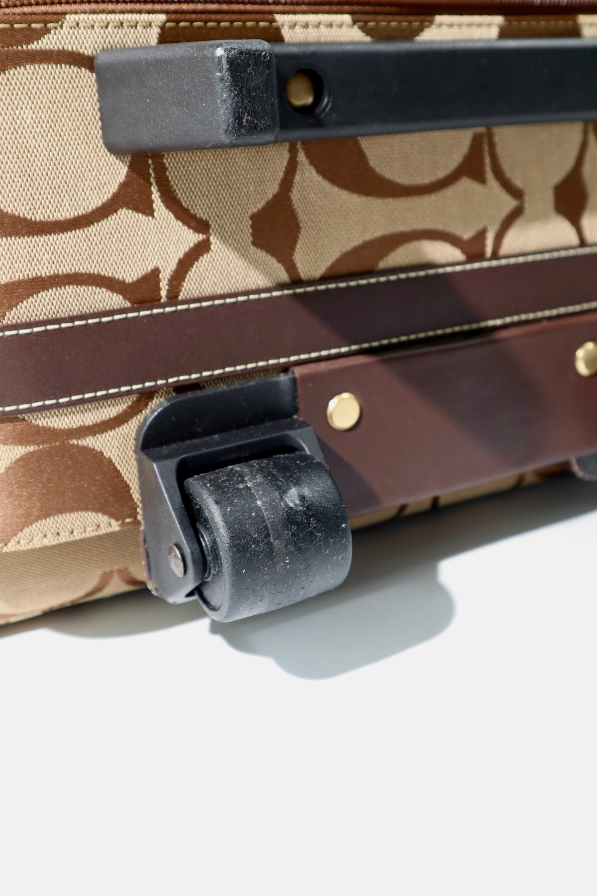Coach Signature Canvas Rolling Carry-On Suitcase, model F77020