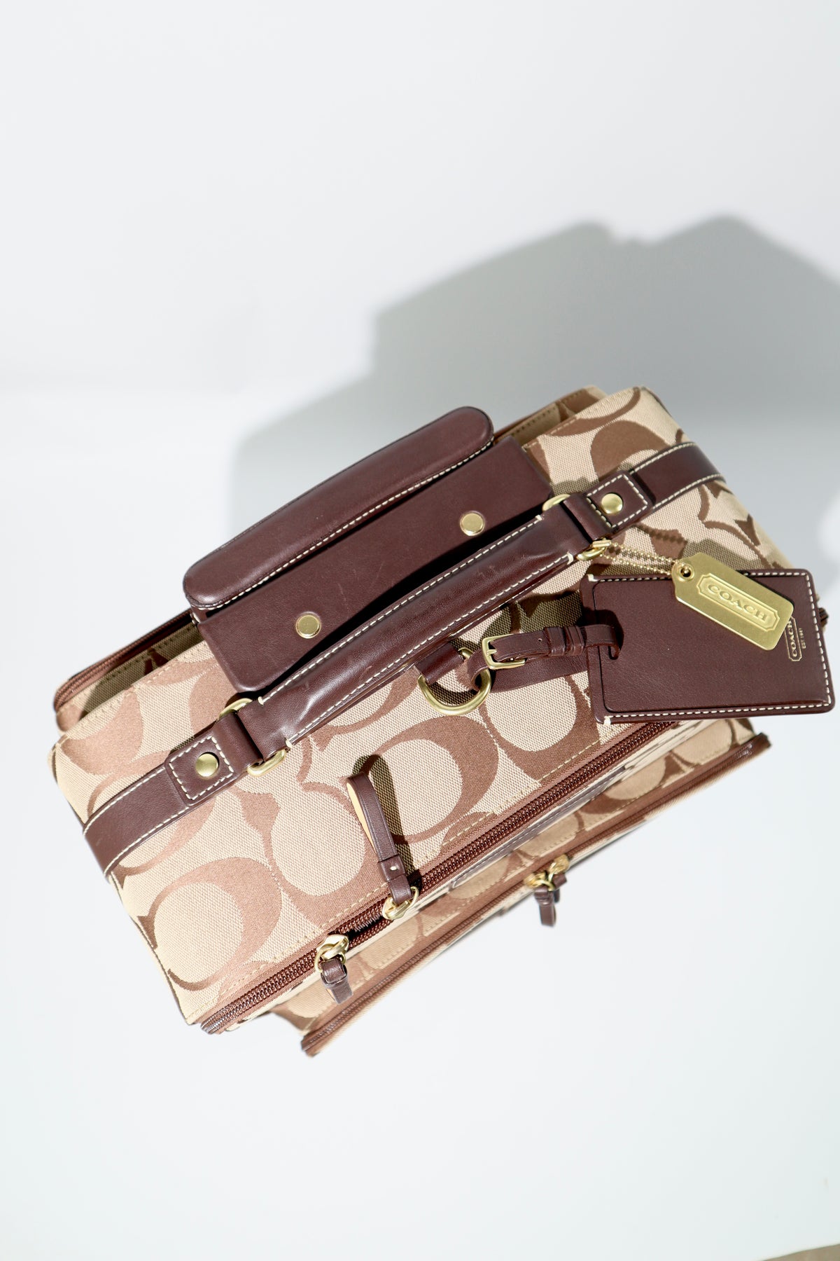 Coach Signature Canvas Rolling Carry-On Suitcase, model F77020