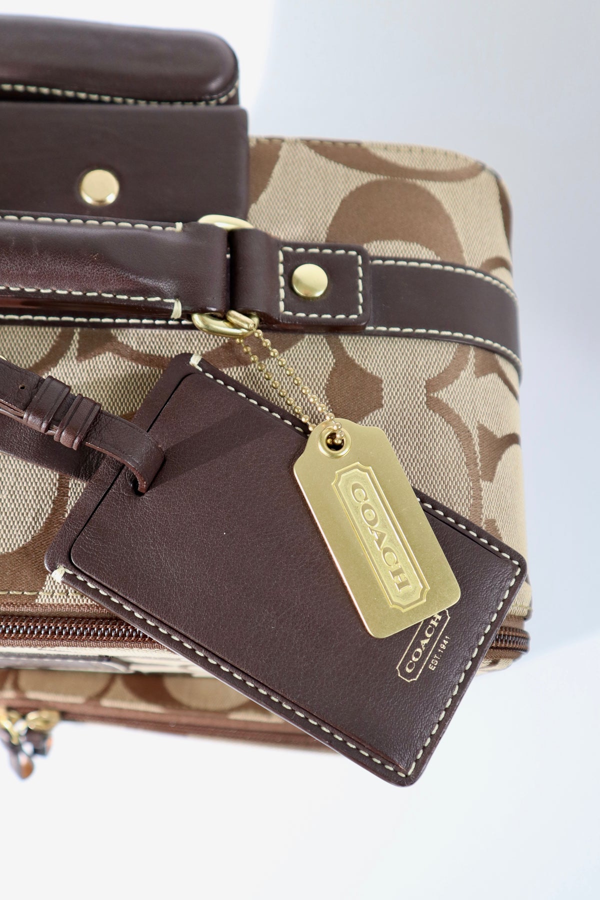 Coach Signature Canvas Rolling Carry-On Suitcase, model F77020