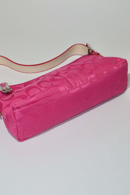 Vintage Coach Hot Pink Baguette Demi Shoulder Bag showing vibrant pink color and signature ‘C’ monogram canvas.
