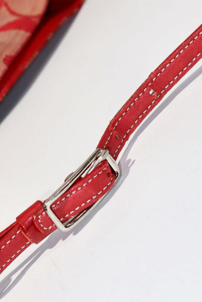 Vintage Coach 2001 Red Clip Tote Shoulder Bag showcasing the handle strap with adjustable buckle strap