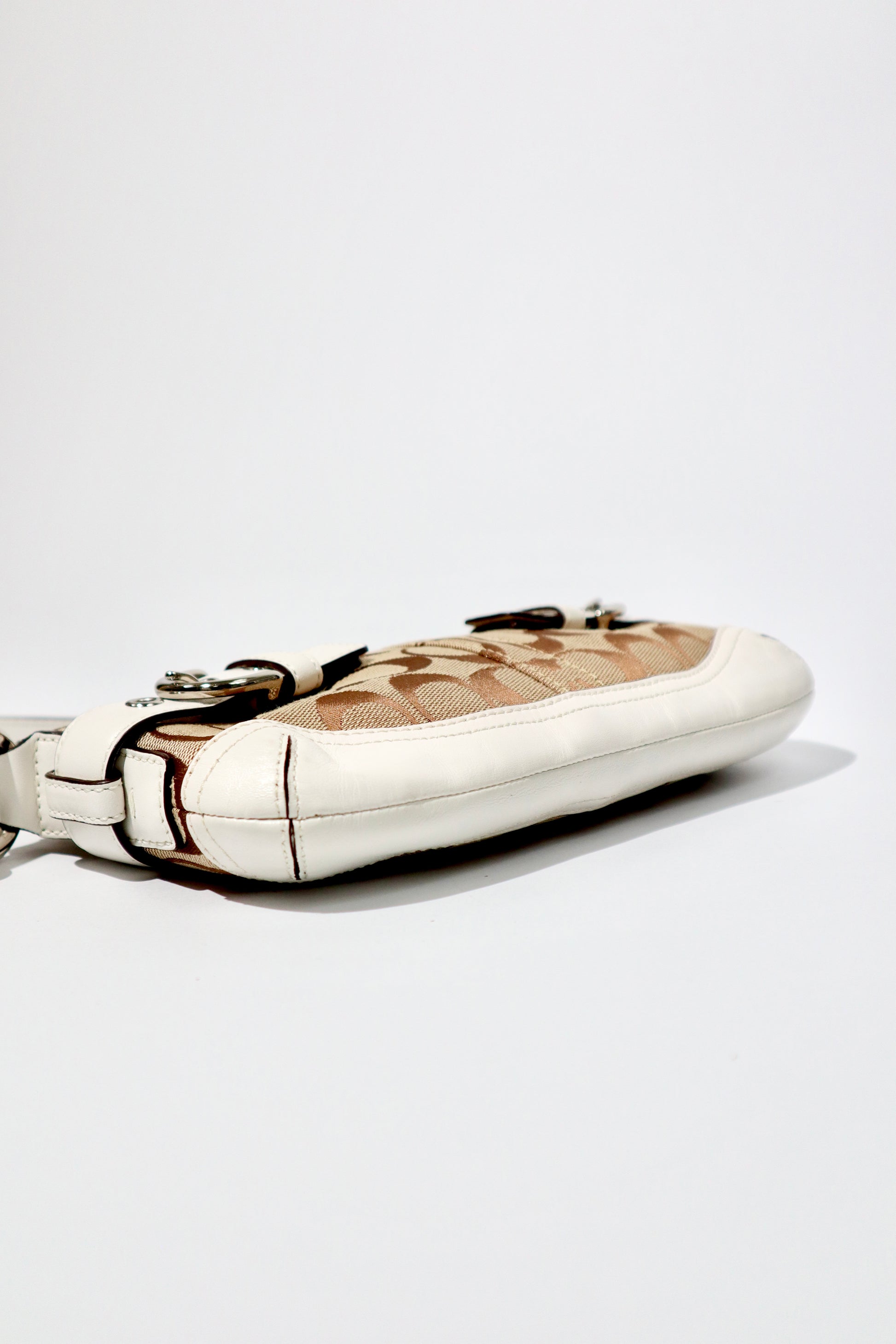 Vintage Coach 2005 Mini Belt Shoulder Bag in Tan & Brown side view showcasing its canvas and leather design.