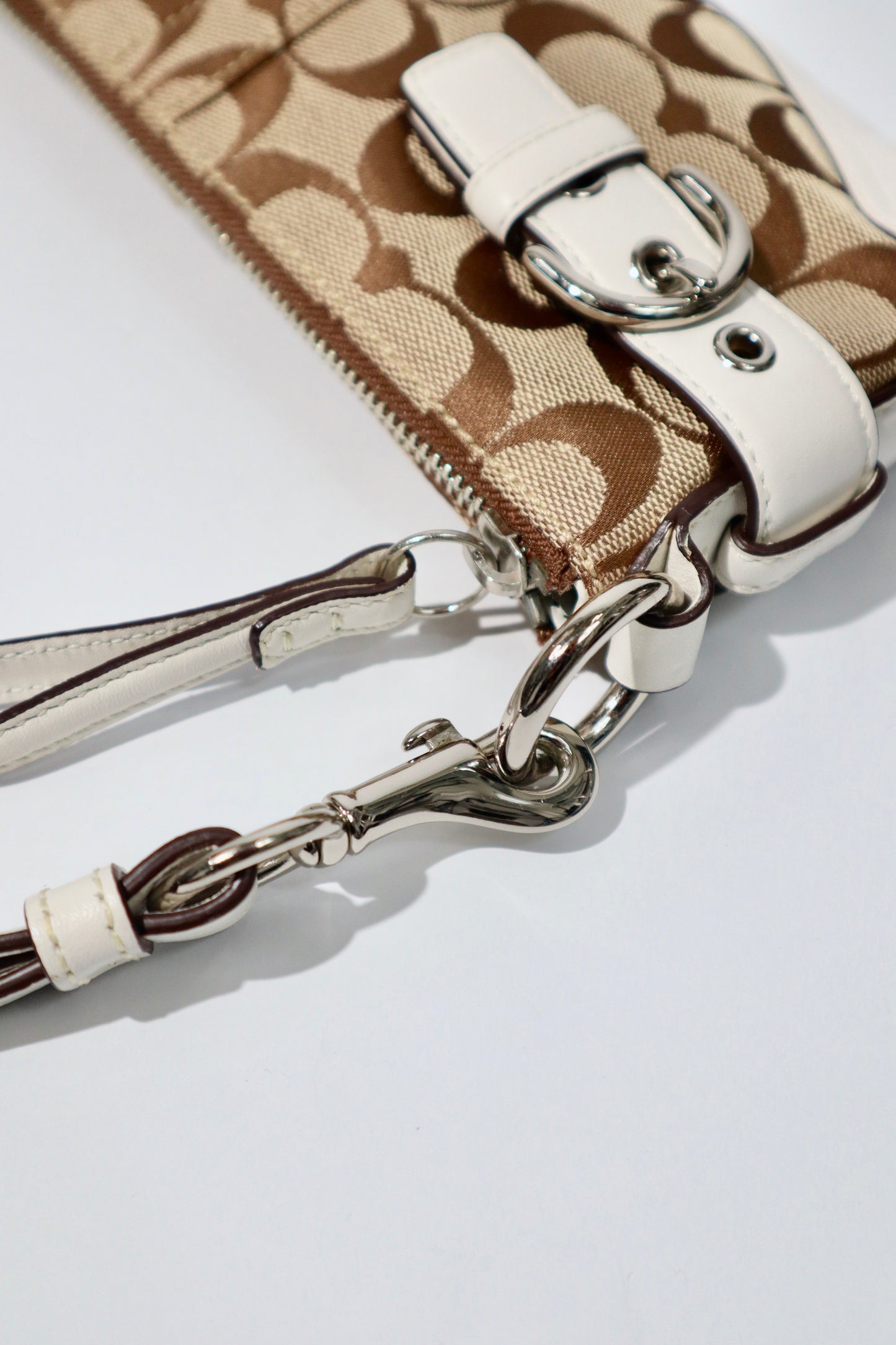 Vintage Coach 2005 Mini Belt Shoulder Bag in Tan & Brown featuring a stylish zip and strap details.