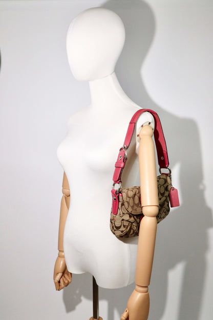 Vintage Coach 2007 Signature Soho Belt Shoulder Bag in Pink worn by mannequin 